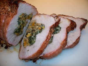 Grilled pork loin stuffed with spinach, apricots, and pistachio nuts.