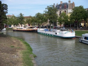 The green and white La Naïade moored in Carcassonne