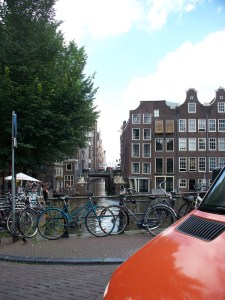 Amsterdam: bikes, canals, tall narrow buildings