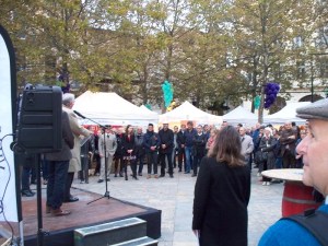 Bill watches as the mayor opens the festival