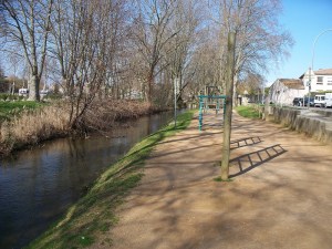 Mill stream walking path with exercise equipment